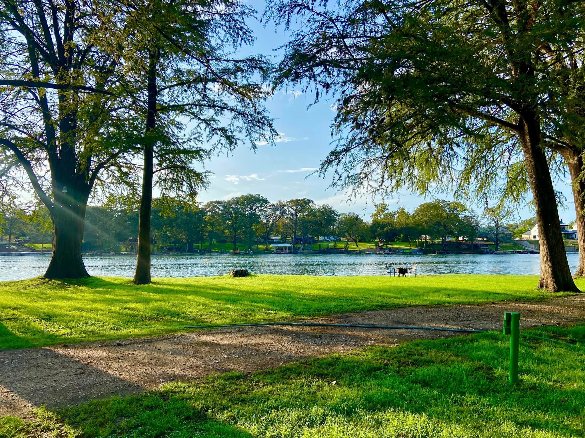 The green landscape and water at Camp Willow Resort